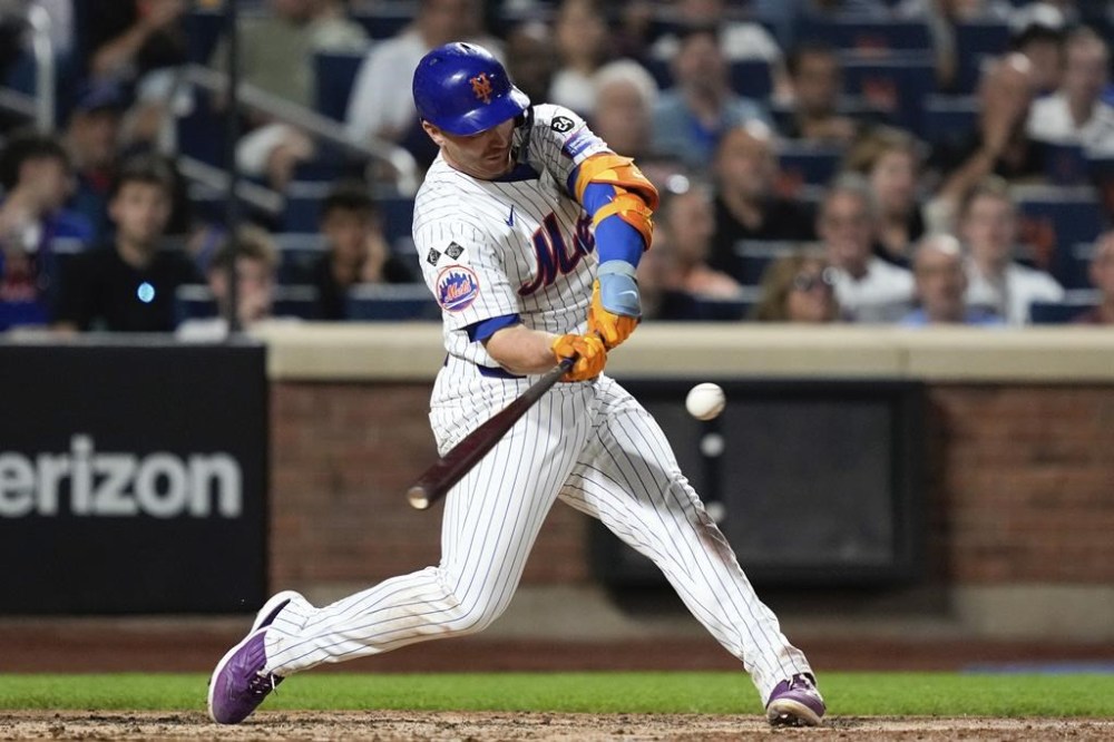 New York Mets' Pete Alonso singles on a line drive during the fifth inning of a baseball game against the Oakland Athletics, Tuesday, Aug. 13, 2024, in New York. (AP Photo/Julia Nikhinson)