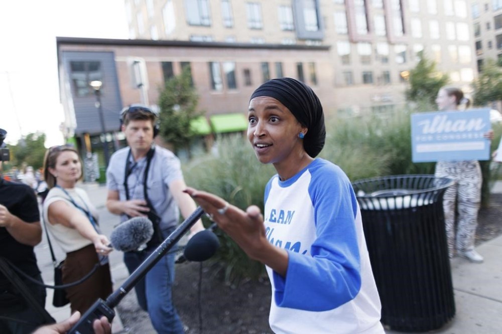 Rep. Ilhan Omar talks with media during a campaign stop in Minneapolis, Tuesday, Aug. 13, 2024. (Kerem Yücel/Minnesota Public Radio via AP)