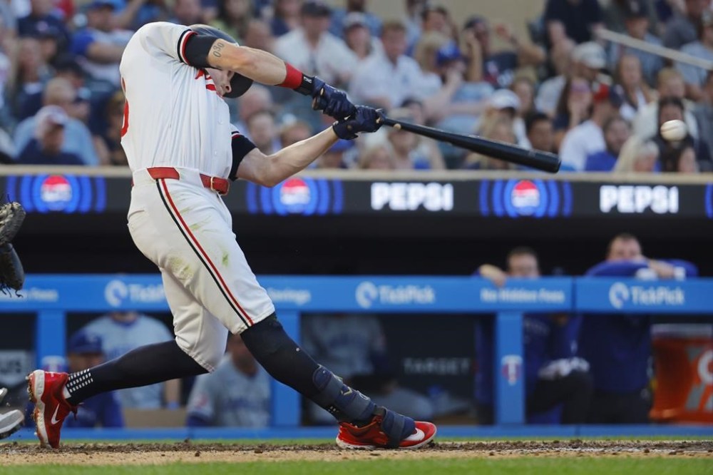 Minnesota Twins' Max Kepler hits an RBI single against the Kansas City Royals in the fifth inning of a baseball game Tuesday, Aug. 13, 2024, in Minneapolis. (AP Photo/Bruce Kluckhohn)