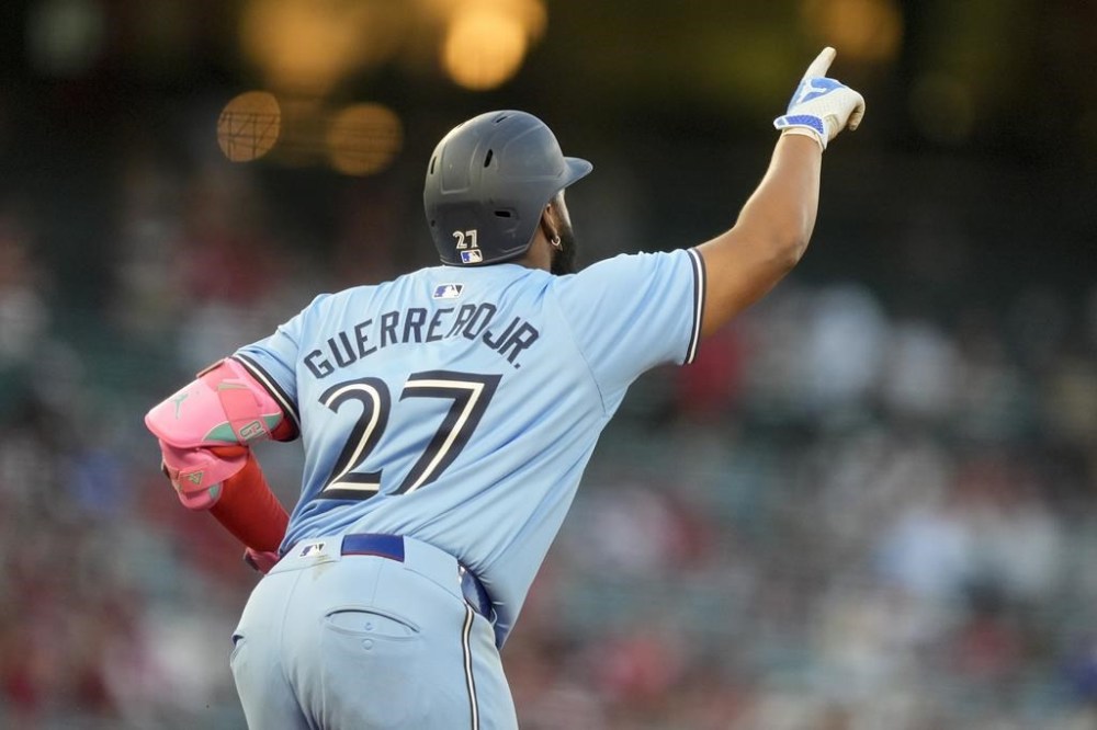 Toronto Blue Jays' Vladimir Guerrero Jr. gestures after hitting a solo-home run during the third inning of a baseball game against the Los Angeles Angels, Tuesday, Aug. 13, 2024, in Anaheim, Calif. (AP Photo/Ryan Sun)