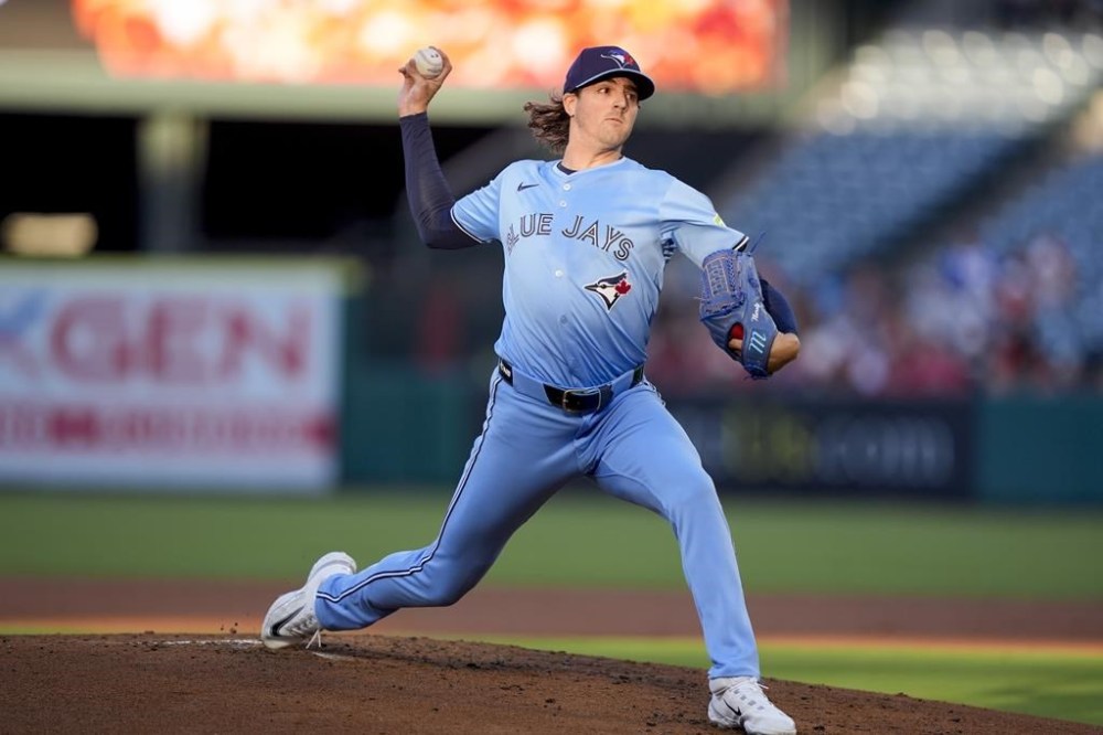 Toronto Blue Jays starting pitcher Kevin Gausman throws during the first inning of a baseball game against the Los Angeles Angels, Tuesday, Aug. 13, 2024, in Anaheim, Calif. (AP Photo/Ryan Sun)
