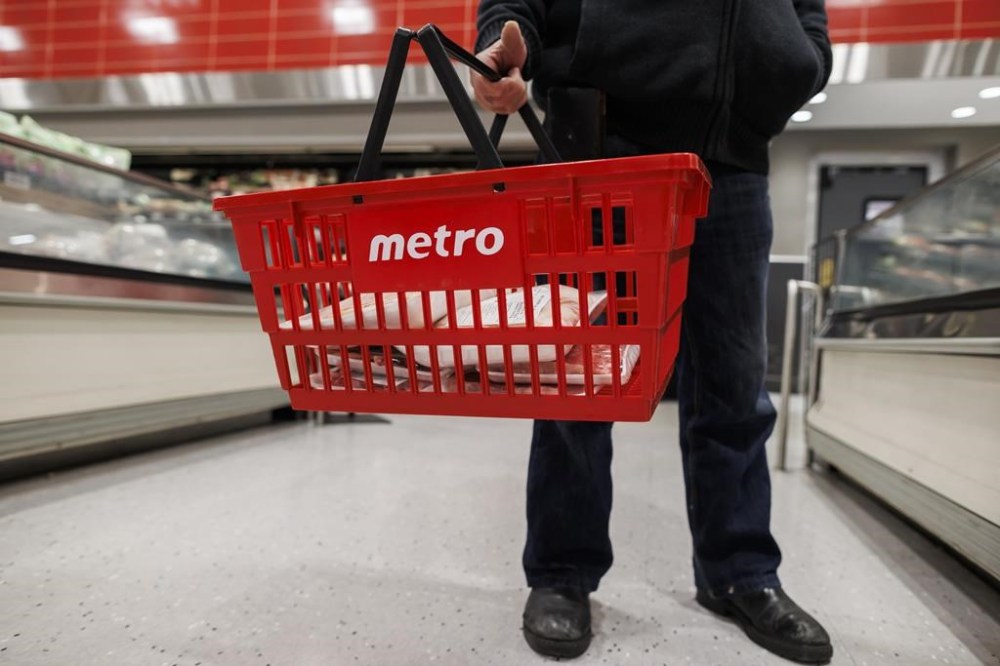 A customer holds their shopping basket at a Metro grocery store In Toronto on Friday, Feb. 2, 2024. THE CANADIAN PRESS/Cole Burston