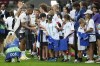 Real Madrid's Kylian Mbappe, left, greets youngsters during a training session ahead of the UEFA Super Cup Final soccer match between Real Madrid and Atalanta at the Narodowy stadium in Warsaw, Poland, Tuesday, Aug. 13, 2024. (AP Photo/Czarek Sokolowski)