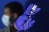 A family nurse practitioner prepares a syringe with the mpox vaccine for inoculating a patient at a vaccination site in the Brooklyn borough of New York, on Tuesday, Aug. 30, 2022. THE CANADIAN PRESS/AP-Jeenah Moon