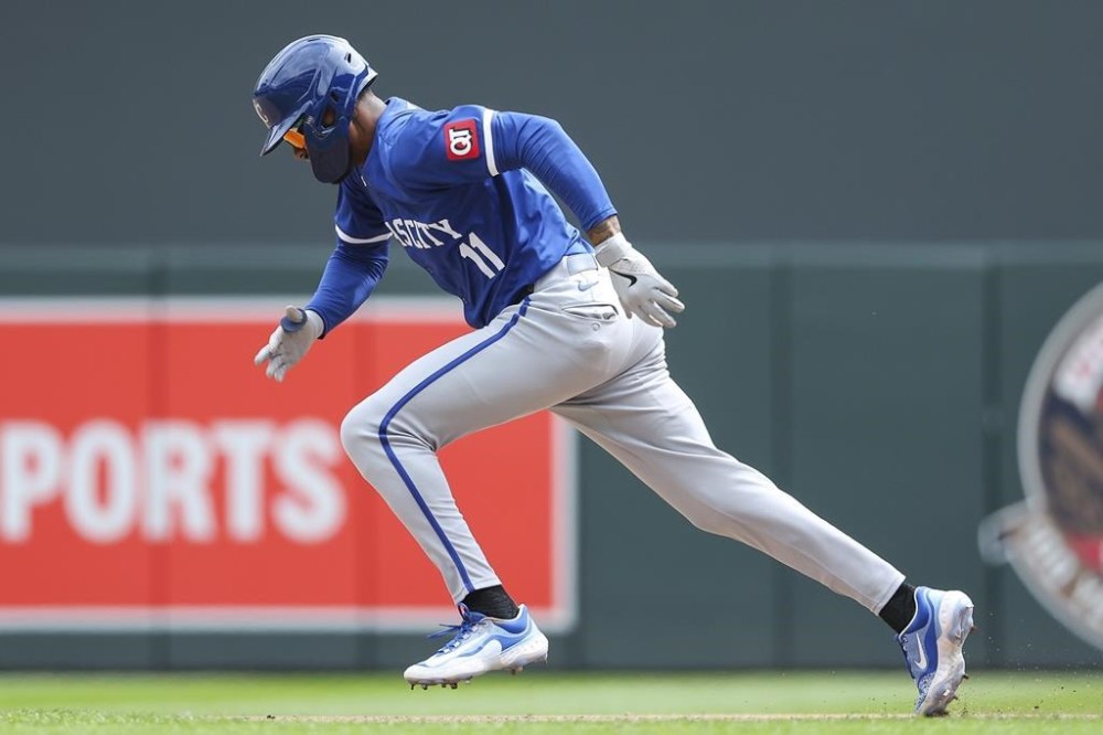 Kansas City Royals pinch runner Maikel Garcia steals second base against the Minnesota Twins during the seventh inning of a baseball game, Wednesday, Aug. 14, 2024, in Minneapolis. (AP Photo/Matt Krohn)