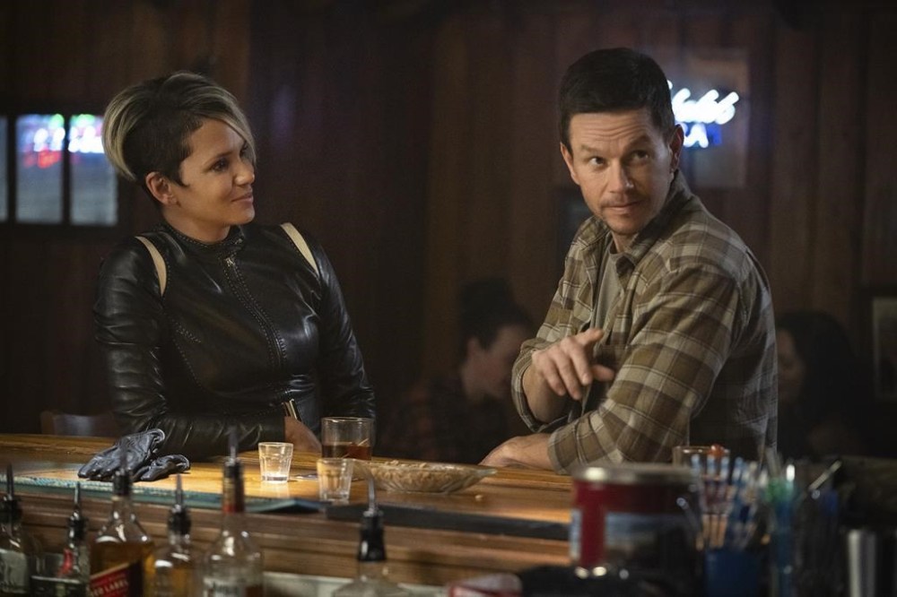 This image released by Netflix shows Halle Berry, left, and Mark Wahlberg in a scene from
