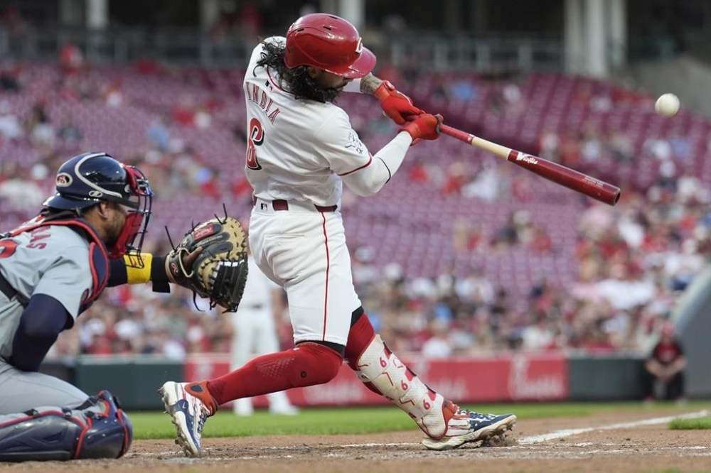Cincinnati Reds' Jonathan India hits a solo home run during the fifth inning of a baseball game against the St. Louis Cardinals, Wednesday, Aug. 14, 2024, in Cincinnati. St. Louis Cardinals catcher Willson Contreras is left. (AP Photo/Carolyn Kaster)