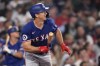 Texas Rangers' Wyatt Langford watches the flight of his three-run home run in the ninth inning of a baseball game against the Boston Red Sox at Fenway Park, Wednesday, Aug. 14, 2024, in Boston. (AP Photo/Charles Krupa)
