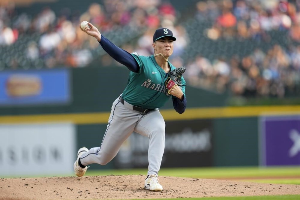 Seattle Mariners pitcher Bryan Woo throws against the Detroit Tigers in the first inning of a baseball game, Wednesday, Aug. 14, 2024, in Detroit. (AP Photo/Paul Sancya)