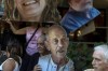 Relatives and supporters of Israeli hostages held by Hamas in Gaza hold photos of their loved ones during a protest calling for their return in Tel Aviv, Thursday, Aug. 15, 2024. (AP Photo/Ariel Schalit)