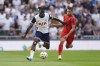 Tottenham Hotspur's Yves Bissouma, left, and Bayern Munich's Jamal Musiala challenge for the ball during the friendly soccer match between Tottenham Hotspur and Bayern Munich, at the Tottenham Hotspur Stadium, London, Saturday, August 10, 2024. (Bradley Collyer/PA via AP)