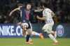FILE - PSG's Milan Skriniar, left, is challenged by Toulouse's Zakaria Aboukhlal during the French League One soccer match between Paris Saint-Germain and Toulouse at the Parc des Princes stadium in Paris, May 12, 2024. (AP Photo/Christophe Ena, File)