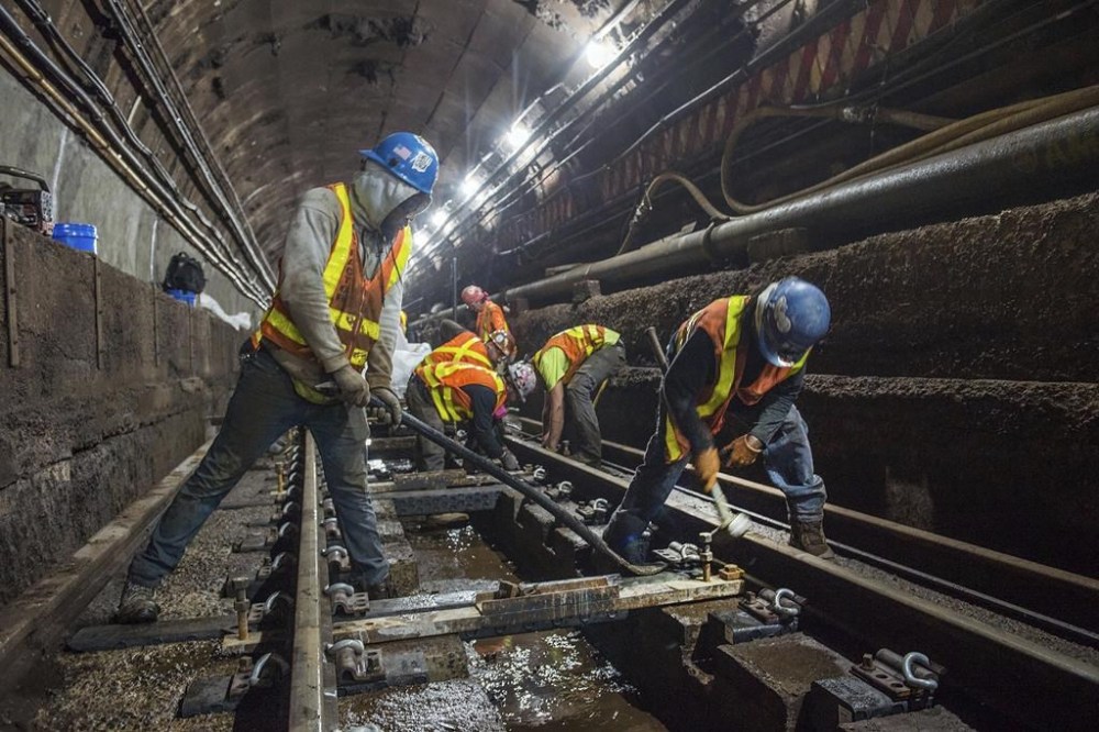 FILE — This photo provided by the Metropolitan Transportation Authority, June 15, 2019, shows workers during the L Project subway tunnel rehabilitation, in New York. (Trent Reeves/Metropolitan Transportation Authority via AP, File)