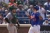 Oakland Athletics catcher Shea Langeliers reacts as New York Mets' Mark Vientos, right, celebrates after hitting a two-run home run during the third inning of a baseball game, Thursday, Aug. 15, 2024, in New York. (AP Photo/Frank Franklin II)