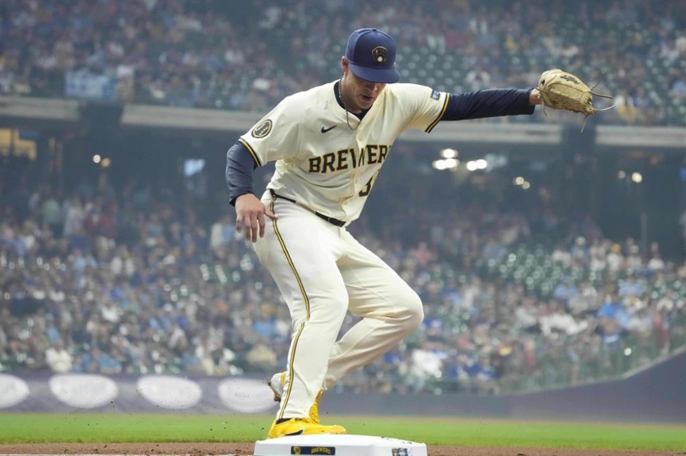 Milwaukee Brewers pitcher Tobias Myers (36) makes the out at first base on a ground out by Los Angeles Dodgers' Freddie Freeman during the first inning of a baseball game, Thursday, Aug. 15, 2024, in Milwaukee. (AP Photo/Kayla Wolf)
