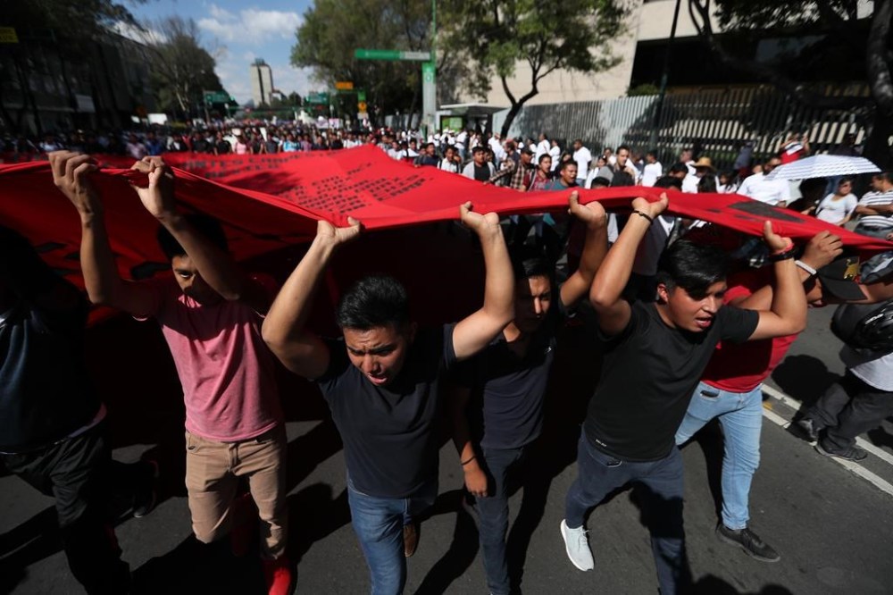 Demonstrators march in remembrance of the 1968 Tlatelolco student massacre, an event considered part of the Mexico's