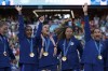 The United States team players celebrate with their gold medals during the medal ceremony after the women's soccer gold medal match between Brazil and the United States at the Parc des Princes during the 2024 Summer Olympics, Saturday, Aug. 10, 2024, in Paris, France. (AP Photo/Aurelien Morissard)