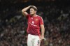 Manchester United's Harry Maguire reacts during the English Premier League soccer match between Manchester United and Fulham at Old Trafford, Friday, Aug. 16, 2024, in Manchester, England. (AP Photo/Dave Thompson)