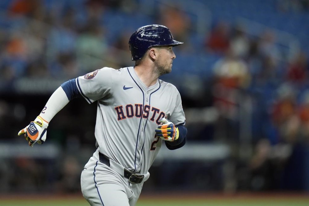 Houston Astros' Alex Bregman watches his home run off Tampa Bay Rays starting pitcher Shane Baz during the fifth inning of a baseball game Tuesday, Aug. 13, 2024, in St. Petersburg, Fla. (AP Photo/Chris O'Meara)