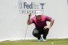 Hideki Matsuyama, of Japan, lines up his putt on the 17th green during the second round of the St. Jude Championship golf tournament Friday, Aug. 16, 2024, in Memphis, Tenn. (AP Photo/Mark Humphrey)