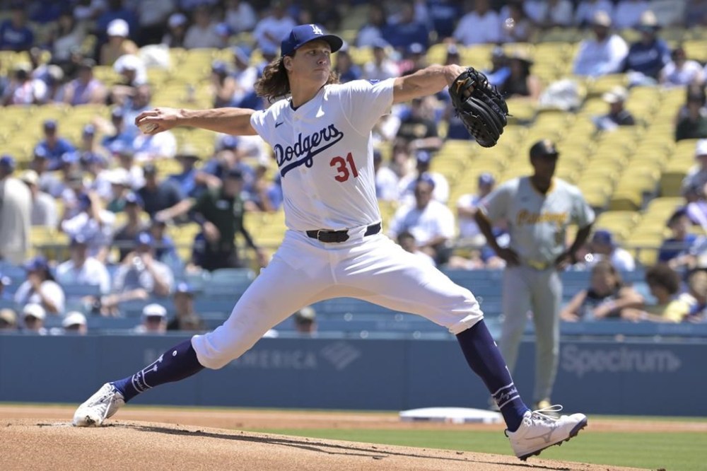 Los Angeles Dodgers' Tyler Glasnow delivers to the plate during the first inning of a baseball game against the Pittsburgh Pirates, Sunday, Aug. 11, 2024, in Los Angeles. (AP Photo/Jayne-Kamin-Oncea)