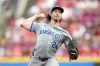 Kansas City Royals pitcher Michael Lorenzen throws in the first inning of a baseball game against the Cincinnati Reds in Cincinnati, Friday, Aug. 16, 2024. (AP Photo/Jeff Dean)