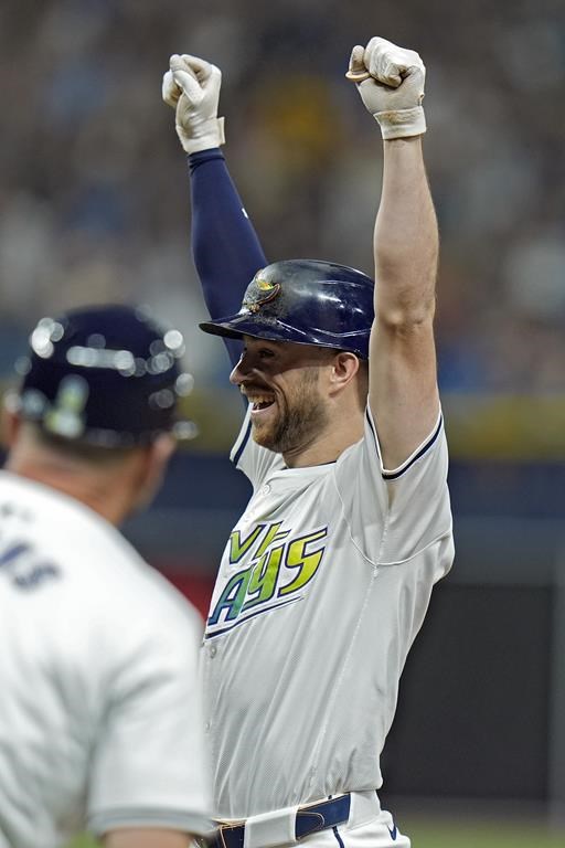 Tampa Bay Rays' Brandon Lowe celebrates his walkoff single off Arizona Diamondbacks relief pitcher Justin Martinez during the ninth inning of a baseball game Friday, Aug. 16, 2024, in St. Petersburg, Fla. (AP Photo/Chris O'Meara)