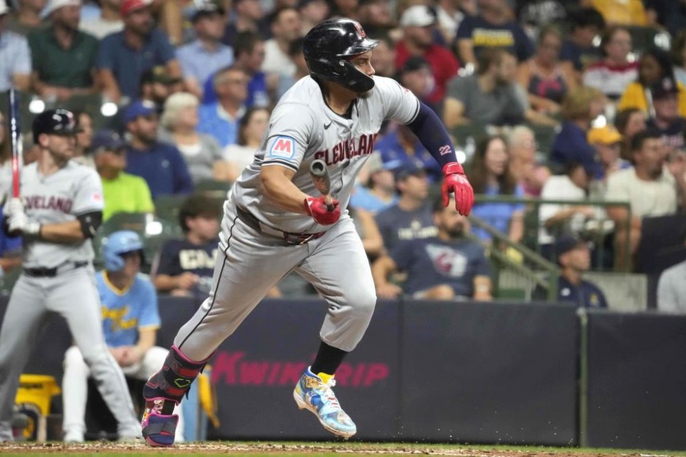 Cleveland Guardians' Josh Naylor runs after hitting a ground ball to left field during the fourth inning of a baseball game against the Milwaukee Brewers, Friday, Aug. 16, 2024, in Milwaukee. (AP Photo/Kayla Wolf)