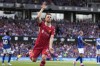 Liverpool's Diogo Jota celebrates after he scores his side's first goal during the English Premier League soccer match between Ipswich Town and Liverpool at Portman Road stadium in Ipswich, England, Saturday, Aug. 17, 2024. (AP Photo/Alastair Grant)