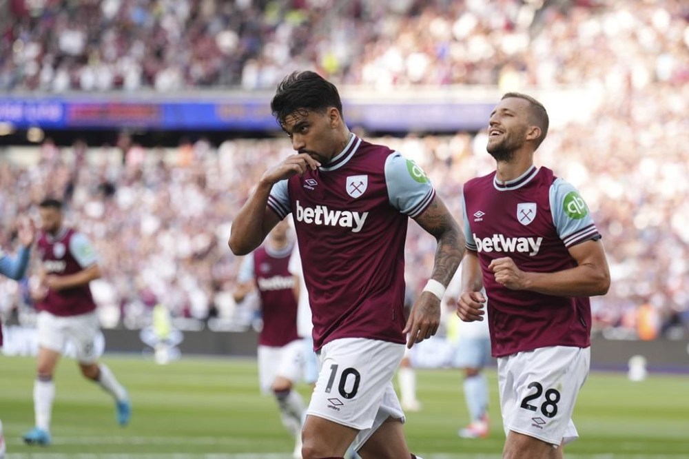 West Ham United's Lucas Paqueta celebrates after scoring his side's first goal during the British Premier League soccer match between West Ham and Aston Villa, at the London Stadium, Saturday Aug. 17, 2024. (Jordan Pettitt/PA via AP)