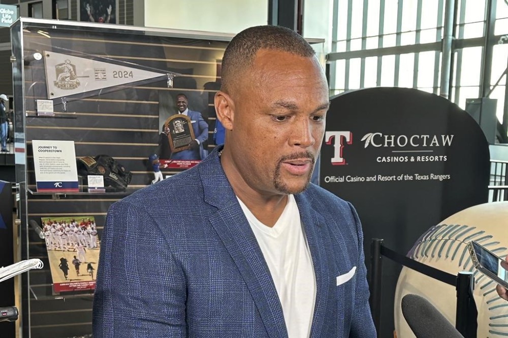 Former Texas Rangers third baseman Adrian Beltre speaks to reporters after the team unveiled a display with memorabilia from his playing days, Friday, Aug. 16, 2024, in Arlington, Texas. (AP Photo/Stephen Hawkins)