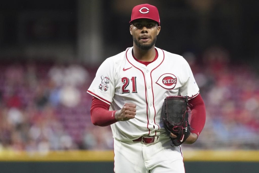 Cincinnati Reds' Hunter Greene pumps his fist after walking off the mound during the seventh inning of a baseball game against the St. Louis Cardinals, Tuesday, Aug. 13, 2024, in Cincinnati. (AP Photo/Kareem Elgazzar)