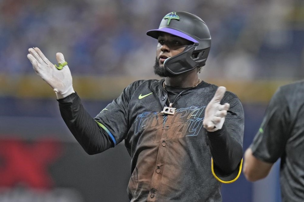 Tampa Bay Rays' Junior Caminero celebrates after his single off Arizona Diamondbacks starting pitcher Zac Gallen during the fifth inning of a baseball game Saturday, Aug. 17, 2024, in St. Petersburg, Fla. (AP Photo/Chris O'Meara)