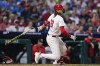 Philadelphia Phillies' Alec Bohm hits an RBI single off Washington Nationals' MacKenzie Gore during the sixth inning of a baseball game, Saturday, Aug. 17, 2024, in Philadelphia. (AP Photo/Derik Hamilton)