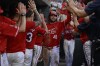 St. Louis Cardinals' Alec Burleson (41) is congratulated by teammates after hitting a two-run home run against the Los Angeles Dodgers during the third inning of a baseball game Saturday, Aug. 17, 2024, in St. Louis. (AP Photo/Jeff Le)