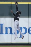 Chicago White Sox center fielder Luis Robert Jr. catches a fly ball hit by Houston Astros' Victor Caratini during the seventh inning of a baseball game Saturday, Aug. 17, 2024, in Houston. (AP Photo/Kevin M. Cox)