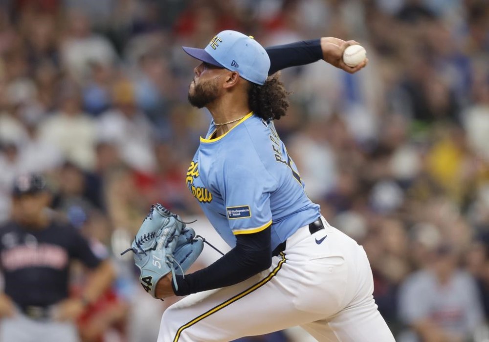 Milwaukee Brewers' starting pitcher Freddy Peralta throws to the Cleveland Guardians during the first inning of a baseball game Saturday, Aug. 17, 2024, in Milwaukee. (AP Photo/Jeffrey Phelps)