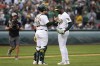 Oakland Athletics catcher Shea Langeliers, front left, and pitcher Michel Otañez, right, celebrate after their victory over the San Francisco Giants in a baseball game Saturday, Aug. 17, 2024, in Oakland, Calif. (AP Photo/Godofredo A. Vásquez)