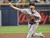 Arizona Diamondbacks pitcher Merrill Kelly throws against the Tampa Bay Rays during the first inning of a baseball game Sunday, Aug. 18, 2024, in St. Petersburg, Fla. (AP Photo/Jason Behnken)