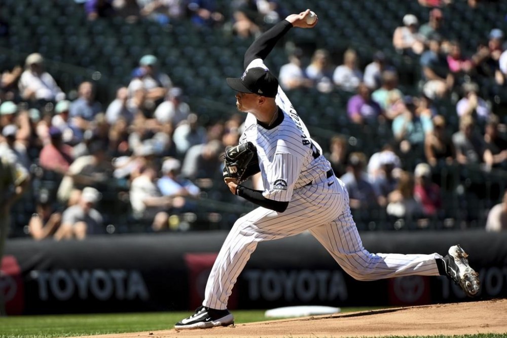 Colorado Rockies starting pitcher Bradley Blalock delivers in the first inning of a baseball game against the San Diego Padres, Sunday, Aug. 18, 2024, in Denver. (AP Photo/Geneva Heffernan)