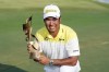 Hideki Matsuyama, of Japan, holds his trophy after winning the St. Jude Championship golf tournament Sunday, Aug. 18, 2024, in Memphis, Tenn. (AP Photo/Mark Humphrey)
