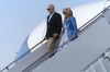 President Joe Biden, left, and first lady Jill Biden walk down the stairs of Air Force One upon arrival to Joint Base Andrews, Md., en route to the White House, Sunday, Aug. 18, 2024. (AP Photo/Jose Luis Magana)