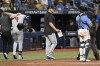 Arizona Diamondbacks manager Torey Lovullo, center, makes a substitution as Diamondbacks' Ketel Marte (4) is helped off the field after being injured while batting during the 10th inning of a baseball game against the Tampa Bay Rays, Sunday, Aug. 18, 2024, in St. Petersburg, Fla. (AP Photo/Jason Behnken)