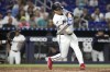 Miami Marlins' Jonah Bride hits a single during third inning the of a baseball game against the Arizona Diamondbacks, Monday, Aug. 19, 2024, in Miami. (AP Photo/Lynne Sladky)