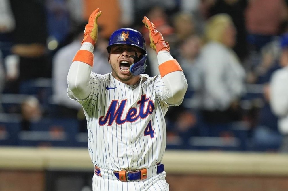 New York Mets' Francisco Alvarez reacts after hitting a walk off home run during the ninth inning of a baseball game against the Baltimore Orioles at Citi Field, Monday, Aug. 19, 2024, in New York. The Mets defeated the Orioles 4-3. (AP Photo/Seth Wenig)