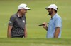 Keegan Bradley, left, talks with Scottie Scheffler at the St. Jude Championship golf tournament Wednesday, Aug. 14, 2024, in Memphis, Tenn. The tournament is scheduled to begin Thursday. (AP Photo/Mark Humphrey)