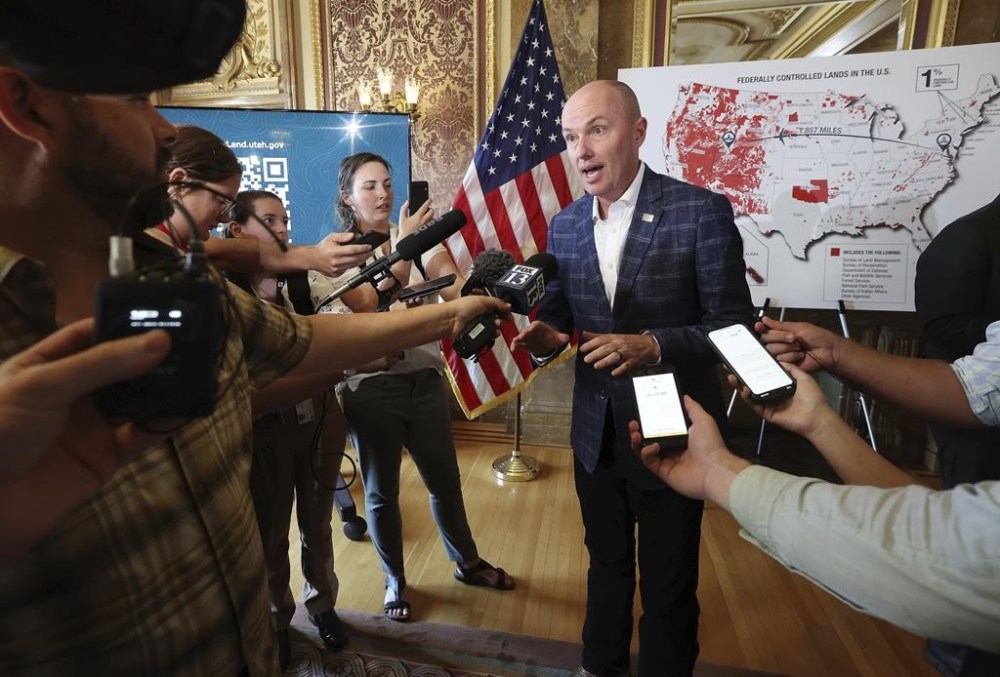 Gov. Spencer J. Cox talks with media after a press conference to announce state action for Utah public lands at the Capitol in Salt Lake City, on Tuesday, Aug. 20, 2024. (Jeffrey D. Allred/The Deseret News via AP)