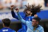 Manchester City's Phil Foden, right, challenges for the ball with Chelsea's Marc Cucurella during the English Premier League soccer match between Chelsea and Manchester City at Stamford Bridge stadium in London, England, Sunday, Aug, 18, 2024. (AP Photo/Dave Shopland)