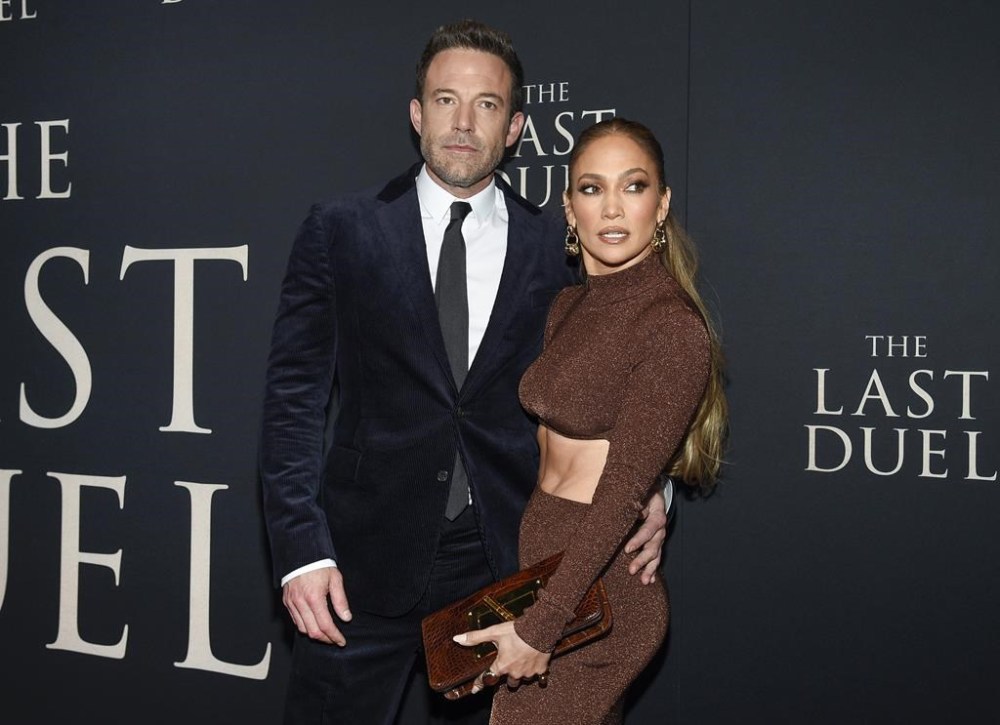 FILE - Actor Ben Affleck, left, and actor-singer Jennifer Lopez attend the premiere of