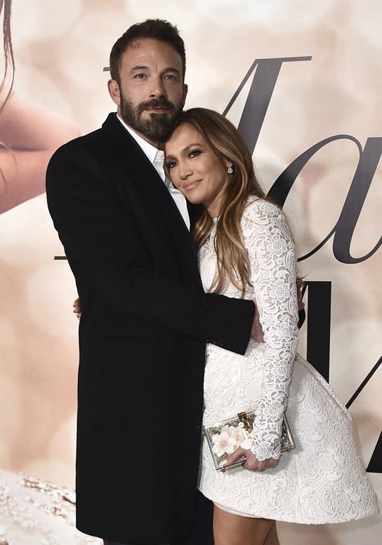 FILE - Cast member Jennifer Lopez, right, and Ben Affleck attend a photo call for a special screening of